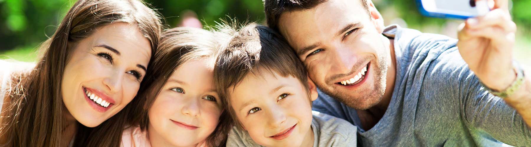 Personal Insurance represented by a family of four taking a selfie